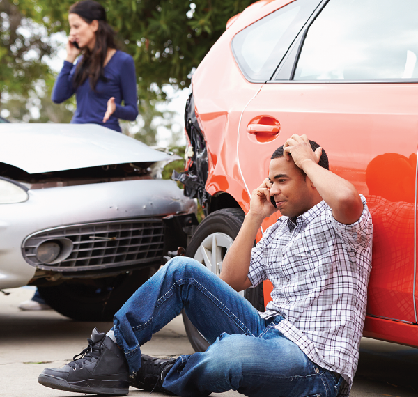 two people on the phone after a car accident
