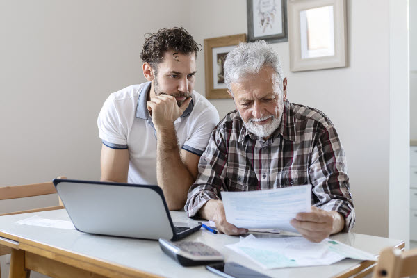 Father and son discussing life insurance