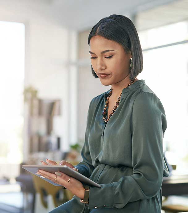 Woman holding tablet in a workplace