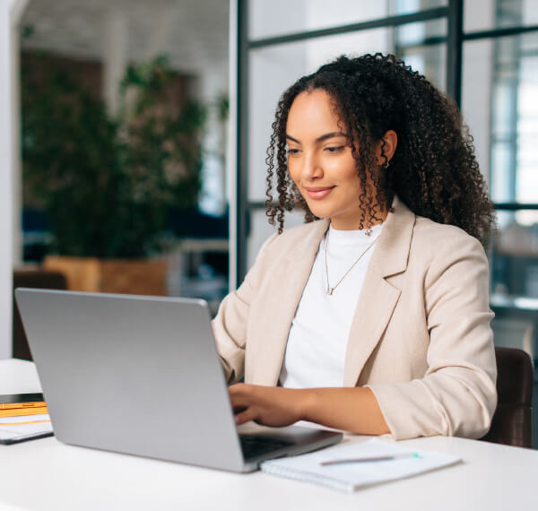 Curly haired woman on laptop