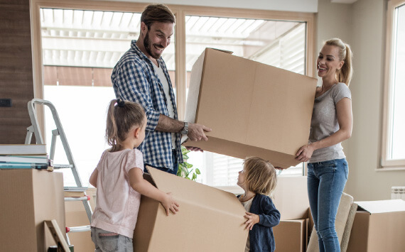 family unpacking boxes