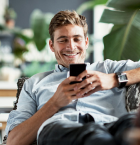 Guy Smiling On phone