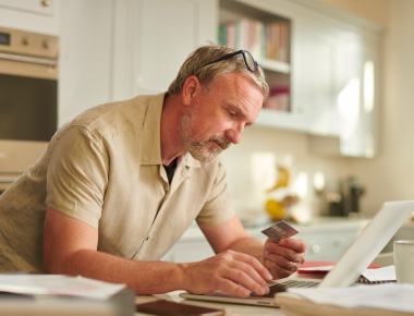 Man with credit card and laptop