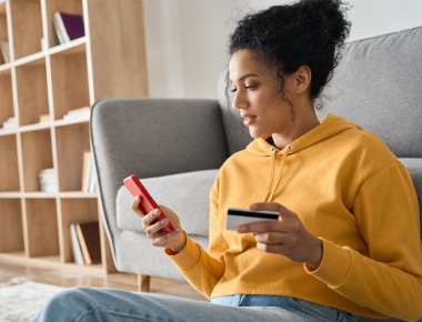Woman on phone with credit card