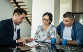 Couple at table with financial advisor