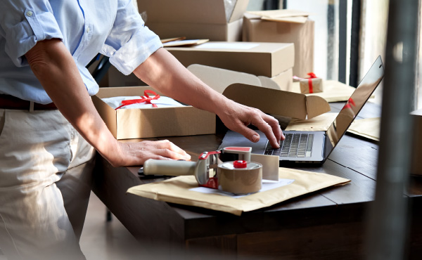 Store Owner wrapping packages