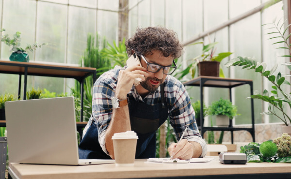 Plant shop owner on phone