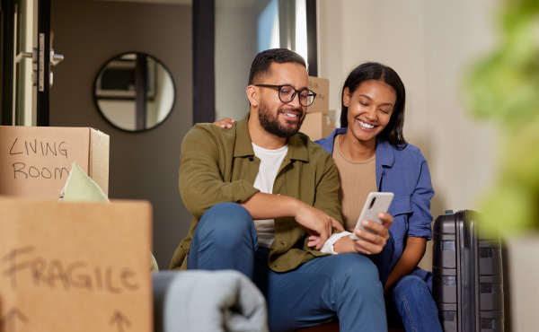 couple sitting down in a home smiling