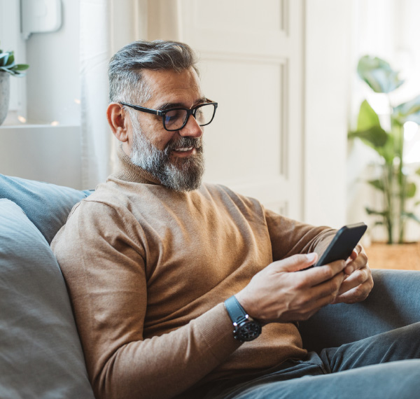 Man smiling on mobile phone