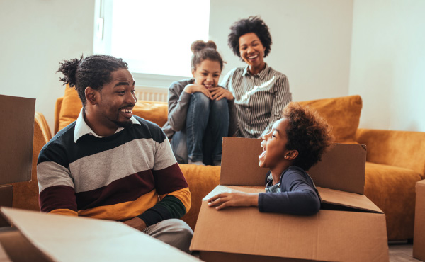 Family laughing unpacking