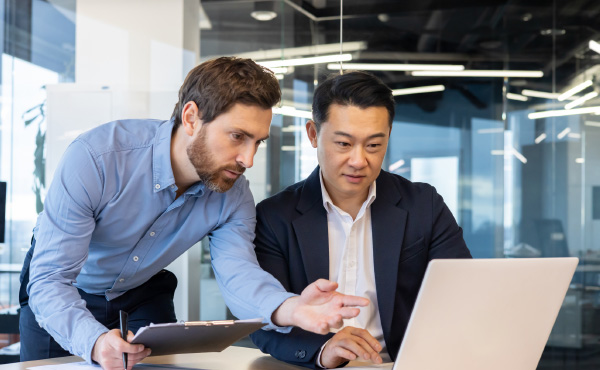 Men looking at computer