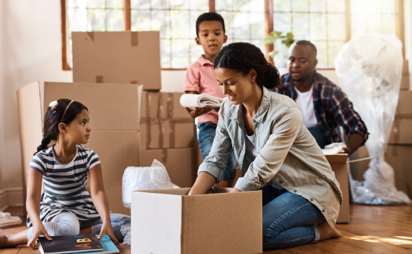Family unpacking a box