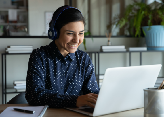 Smiling woman working at computer
