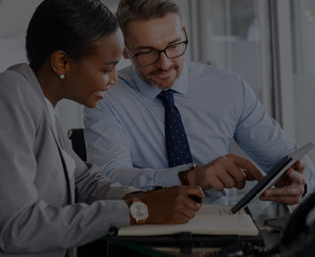 Man and woman looking at tablet