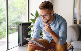 man looking at tablet