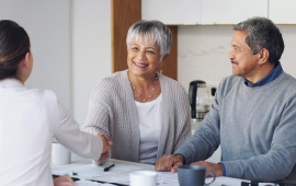 Woman shaking hands with man