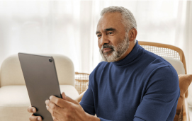 a man looking at a tablet