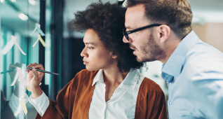 Woman writing on board