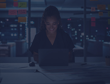 Woman smiling on laptop
