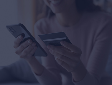 Woman on phone making a payment