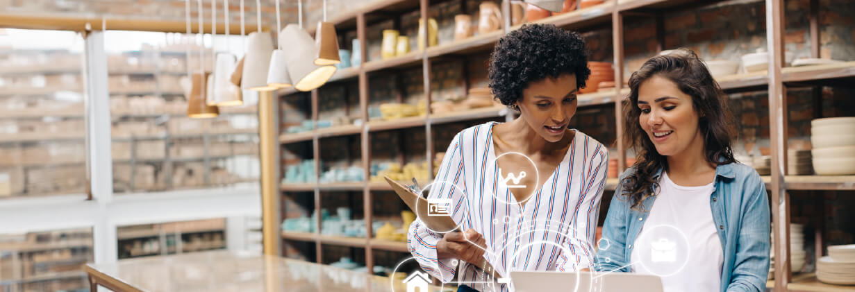 women looking at a computer in a store