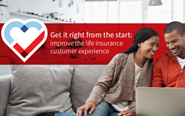 Young couple applying for life insurance on the couch