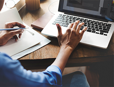 person applying for final exoense on laptop