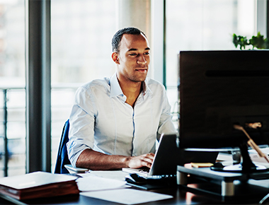man applying for final expense on computer