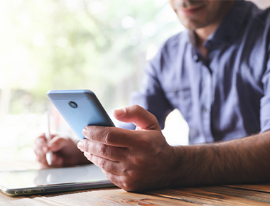man applying for life insurance on cell phone
