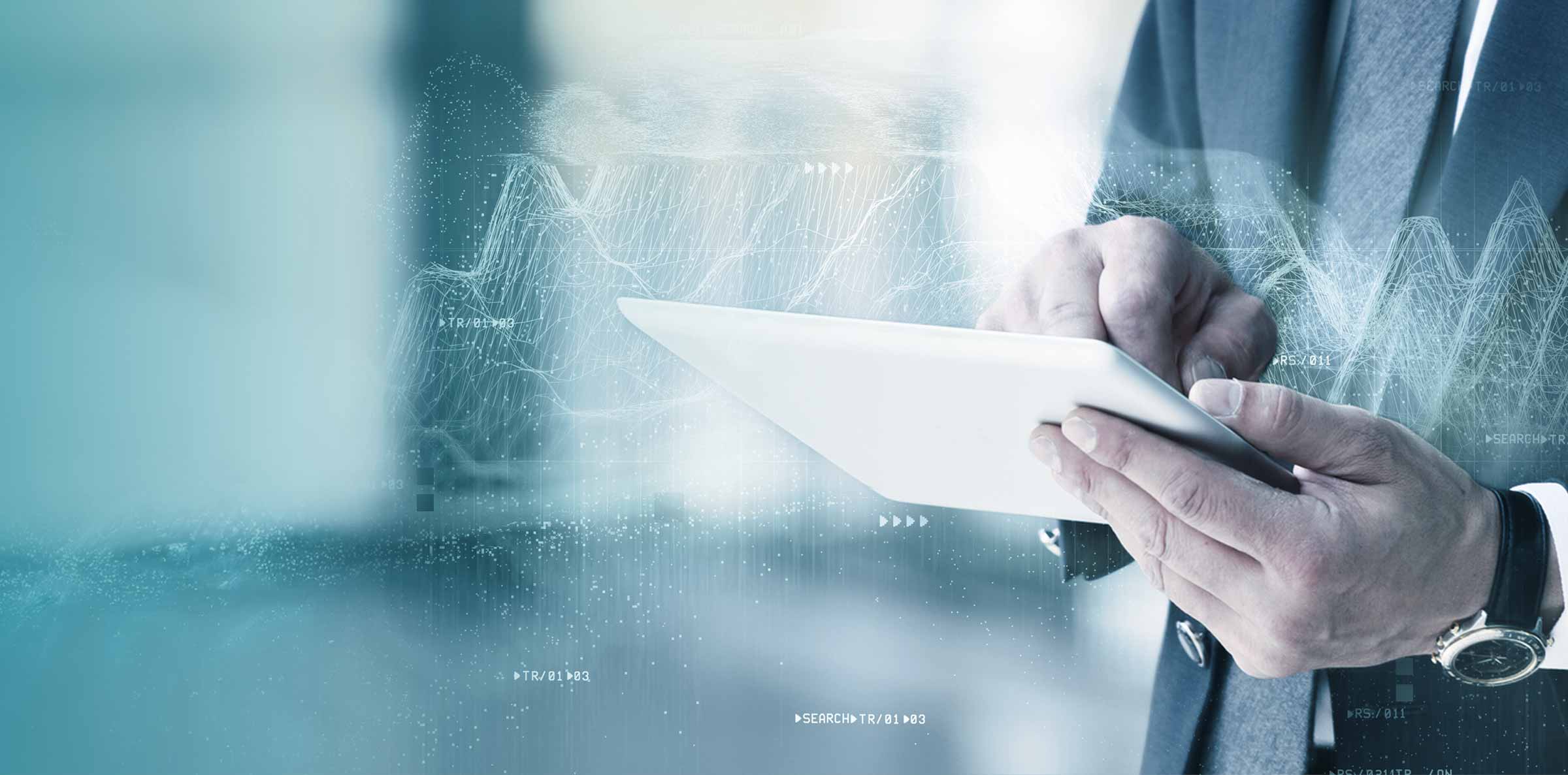 Man holding tablet with data surrounding hands