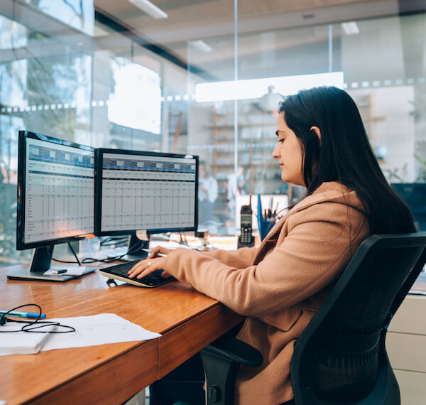 woman working at computer desk
