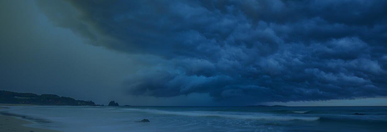 Photo of storm clouds over beach mantle image